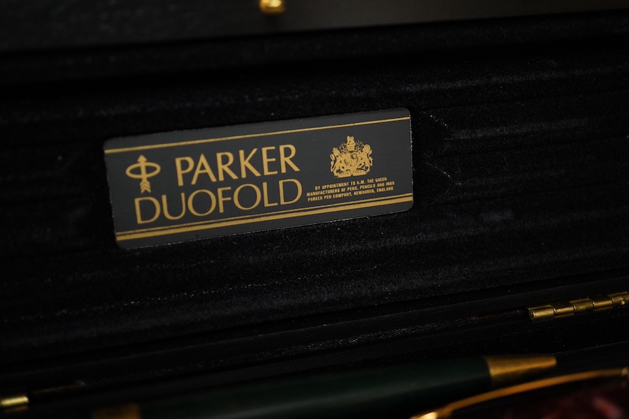 A quantity of various pens to include Parker Duofold and two Parker pen cases. Condition - varies